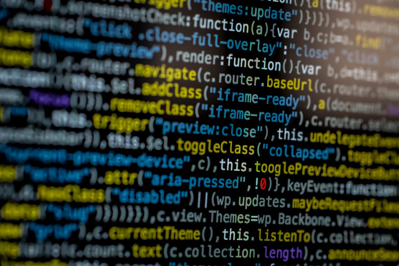 An extreme close-up of colorful programming code on a computer screen, showcasing development and software debugging.